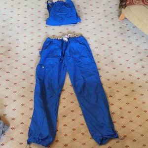 2 pair of non used scrubs.